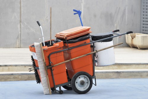 Company vehicle at a commercial site with staff preparing waste collection