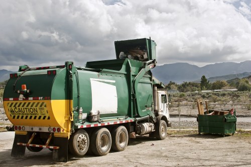 Workers sorting recyclable materials at a commercial collection point